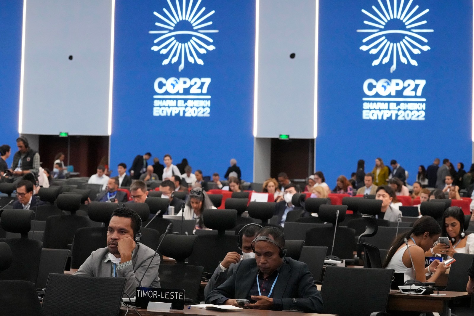 Delegates from Timor listen to speeches at the COP27 on Nov. 8, 2022, in Sharm el-Sheikh, Egypt.