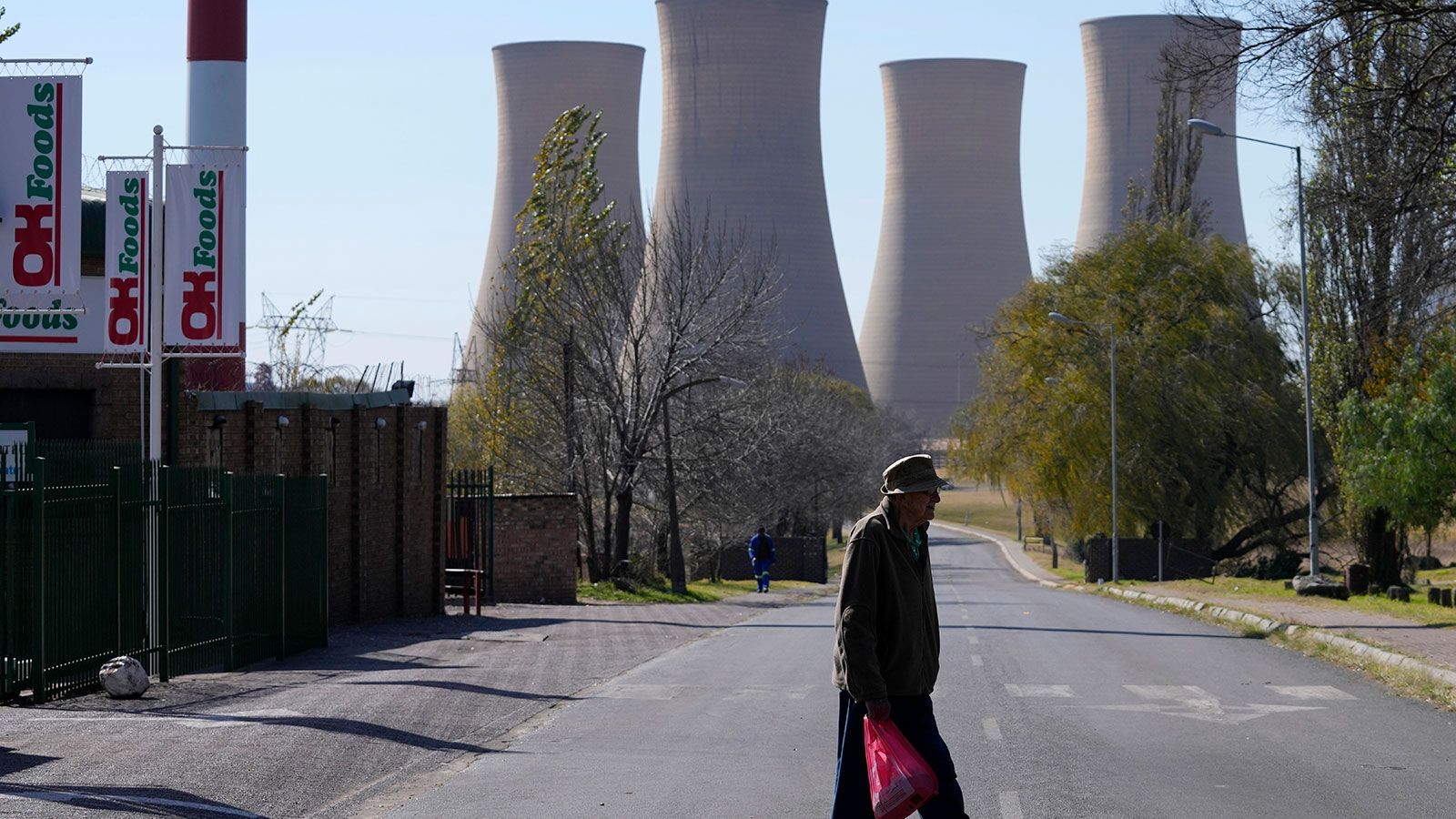 A man walks across from a grocery shop at Komati Power Station in Middelburg, South Africa