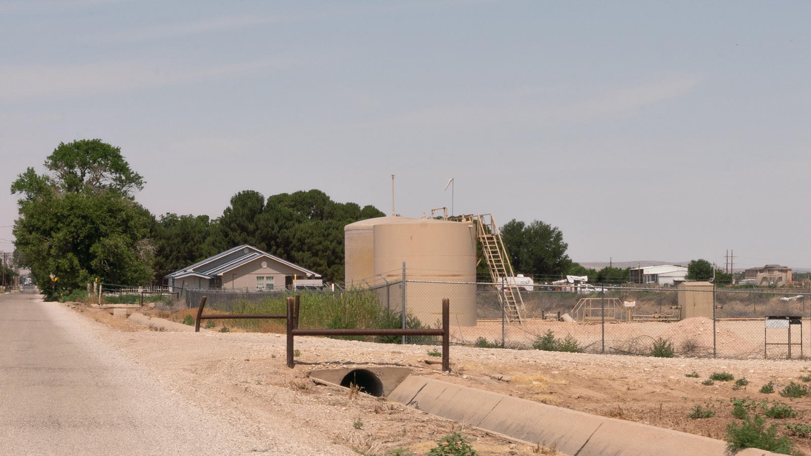 A home sits next to a well in the Permian Basin in southeastern New Mexico.