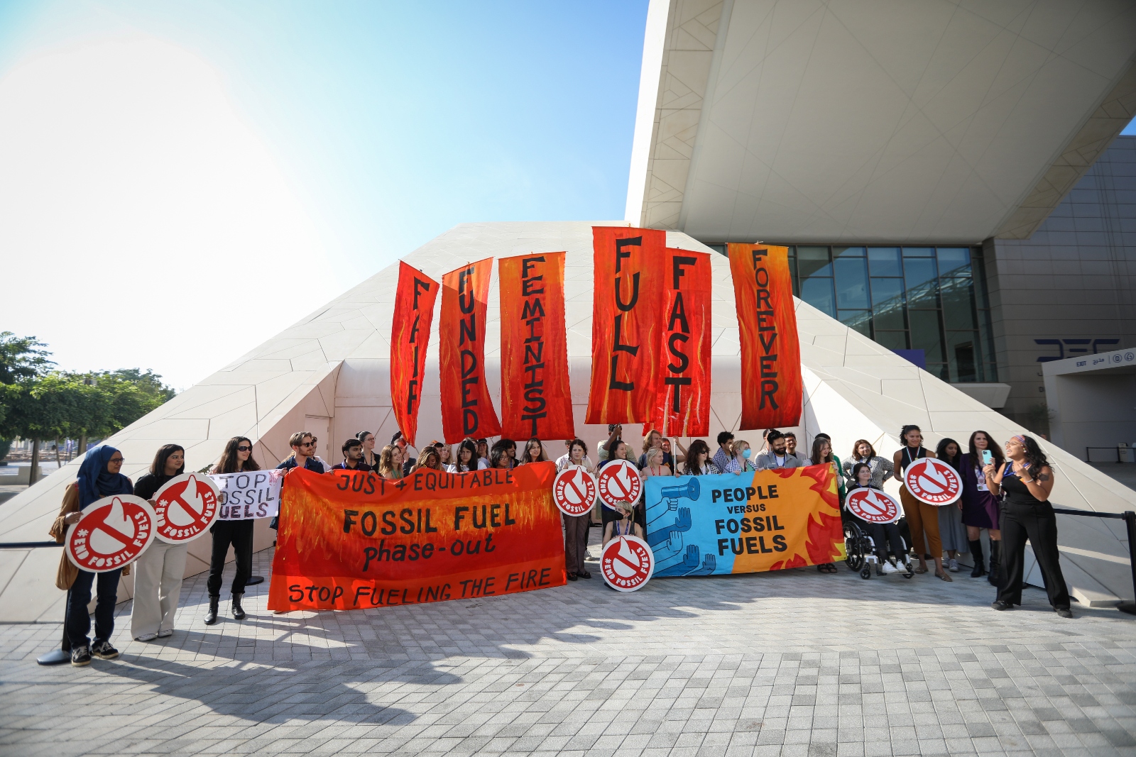 Activists stage a protest on day thirteen of COP28, calling for a phaseout of fossil fuels. The conference went into overtime as negotiators debated whether to move away from coal, oil, and gas.