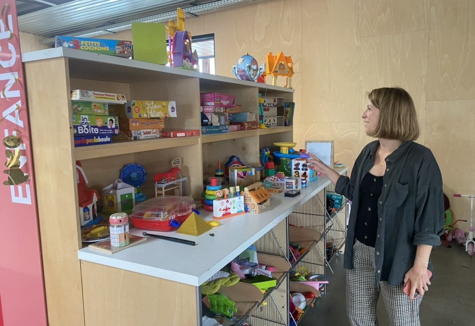 Woman browsing toys on shelf
