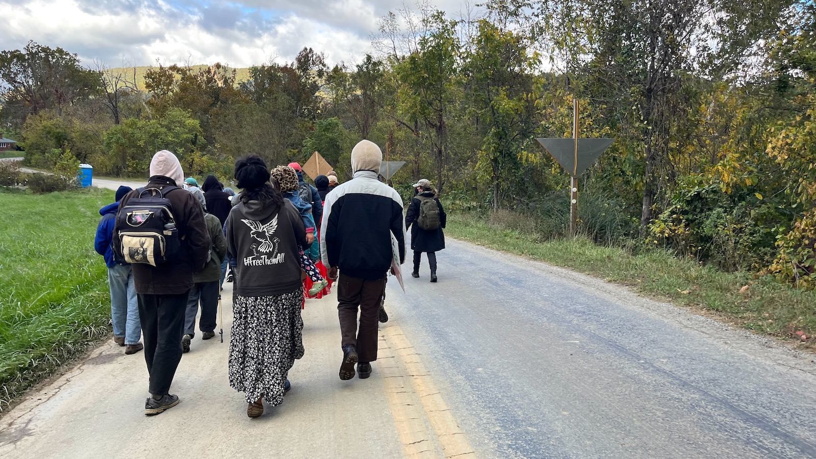 Protestors head toward a Mountain Valley Pipeline construction site in the mountains near Elliston, Virginia, in October 2023.
