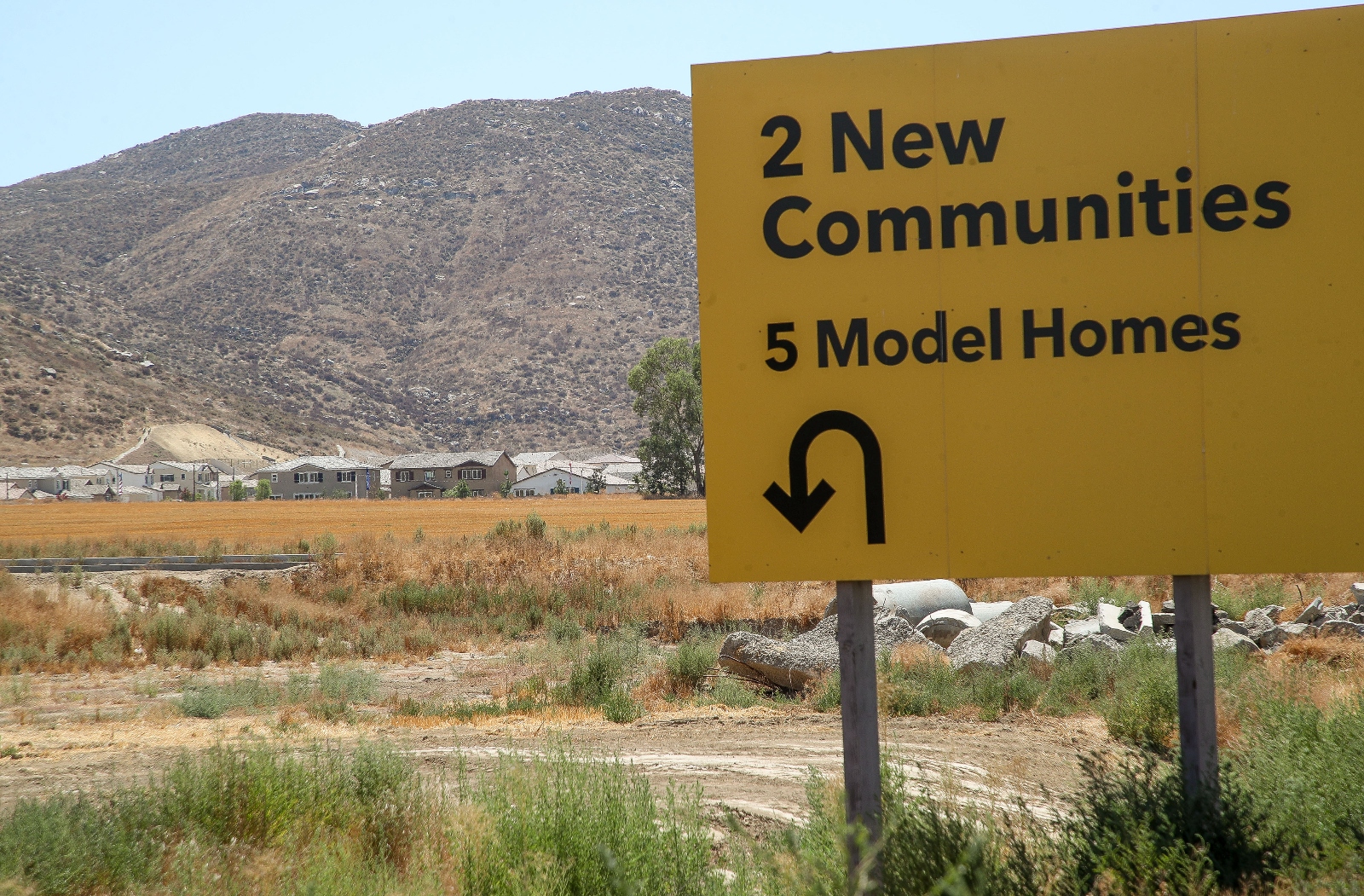 A sign advertising new model homes in Winchester, California