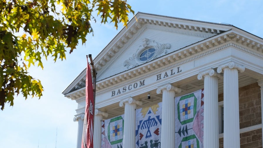 A white building with columns that reads Bascom Hall