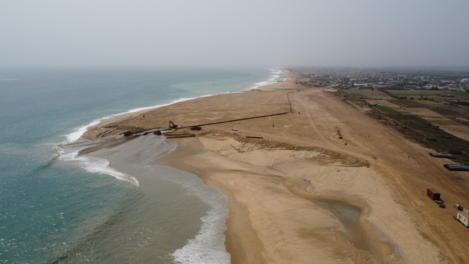 An aerial shot shows the shape of a 'sand motor' project in Benin. The project was built by the dredging firm Boskalis with funding from a World Bank erosion initiative.