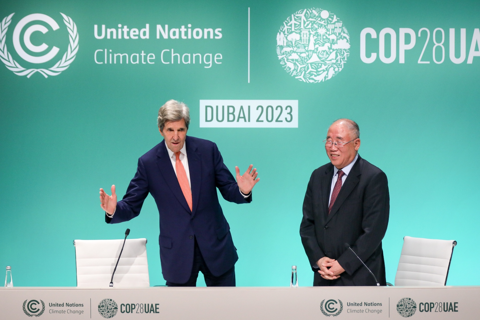U.S. climate envoy John Kerry and his Chinese counterpart Xie Zhenhua speak at COP28 in the United Arab Emirates. The two diplomats worked together for years on climate issues.