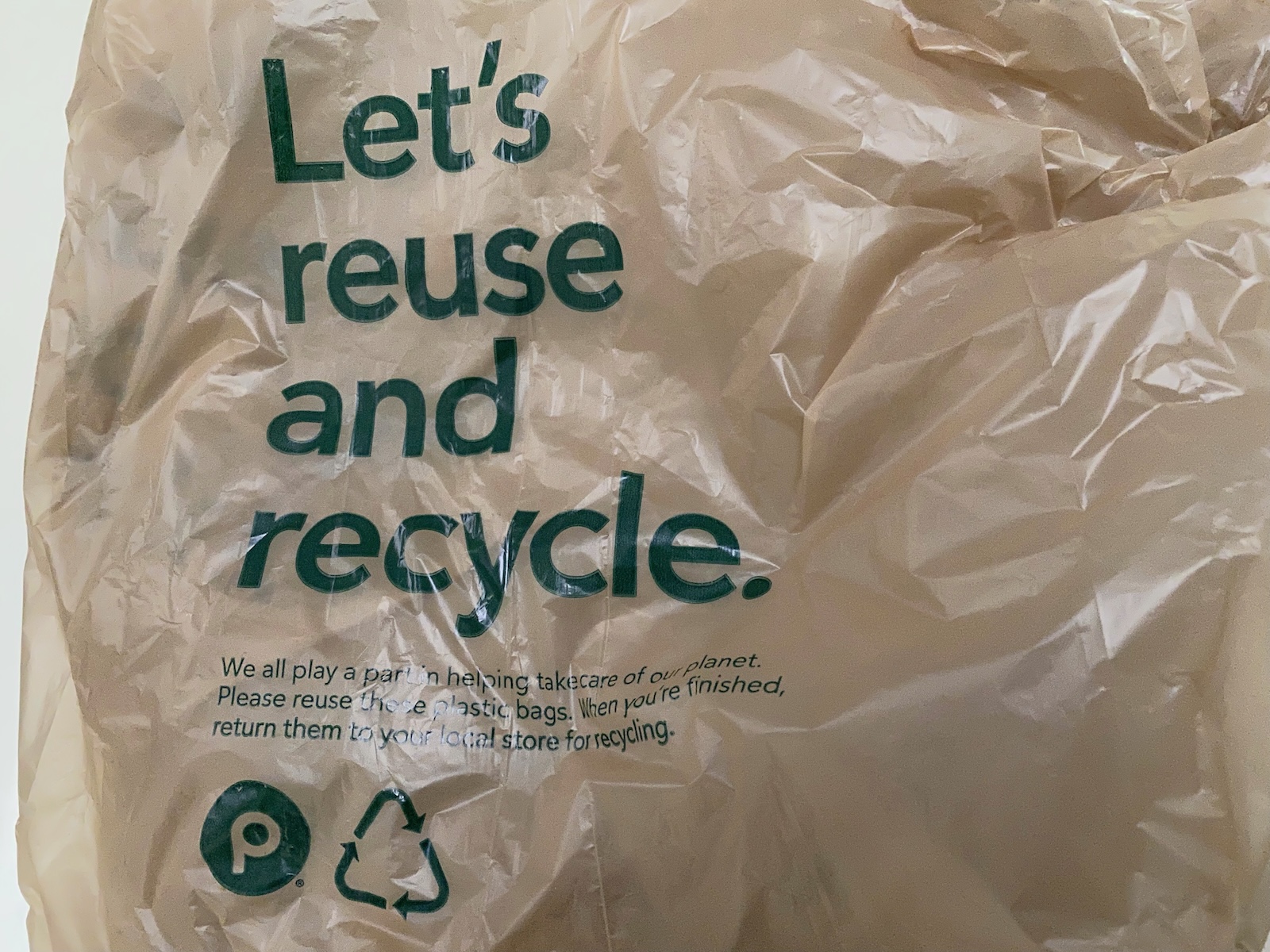 Plastic bag with text: Let's reuse and recycle