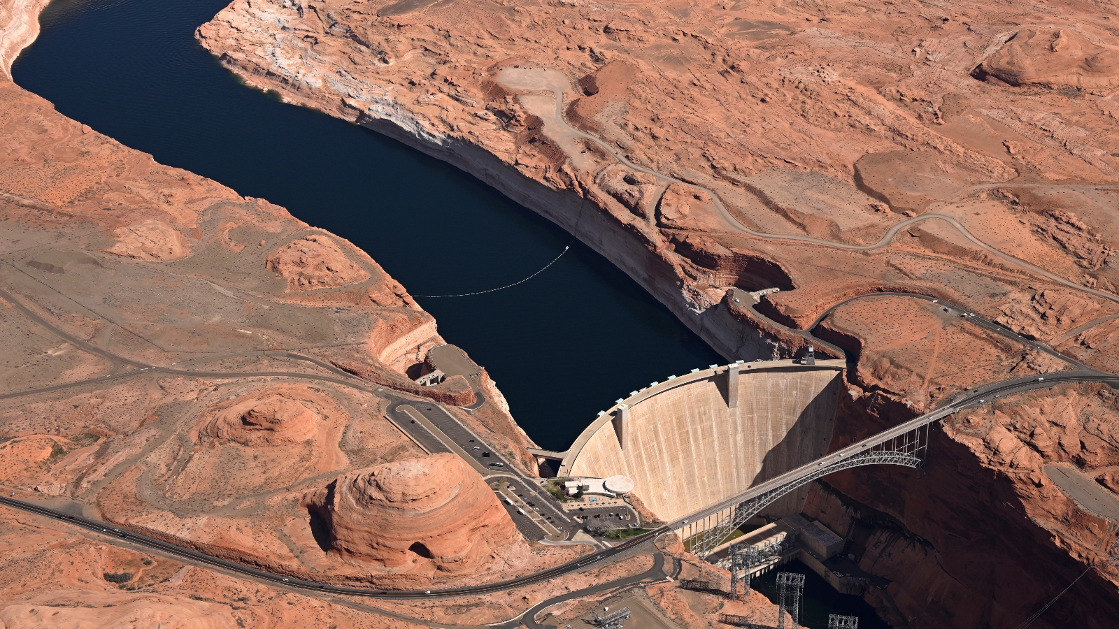 Glen Canyon Dam holds back water to create the Lake Powell reservoir. The dam divides the river's Upper Basin from its Lower Basin.