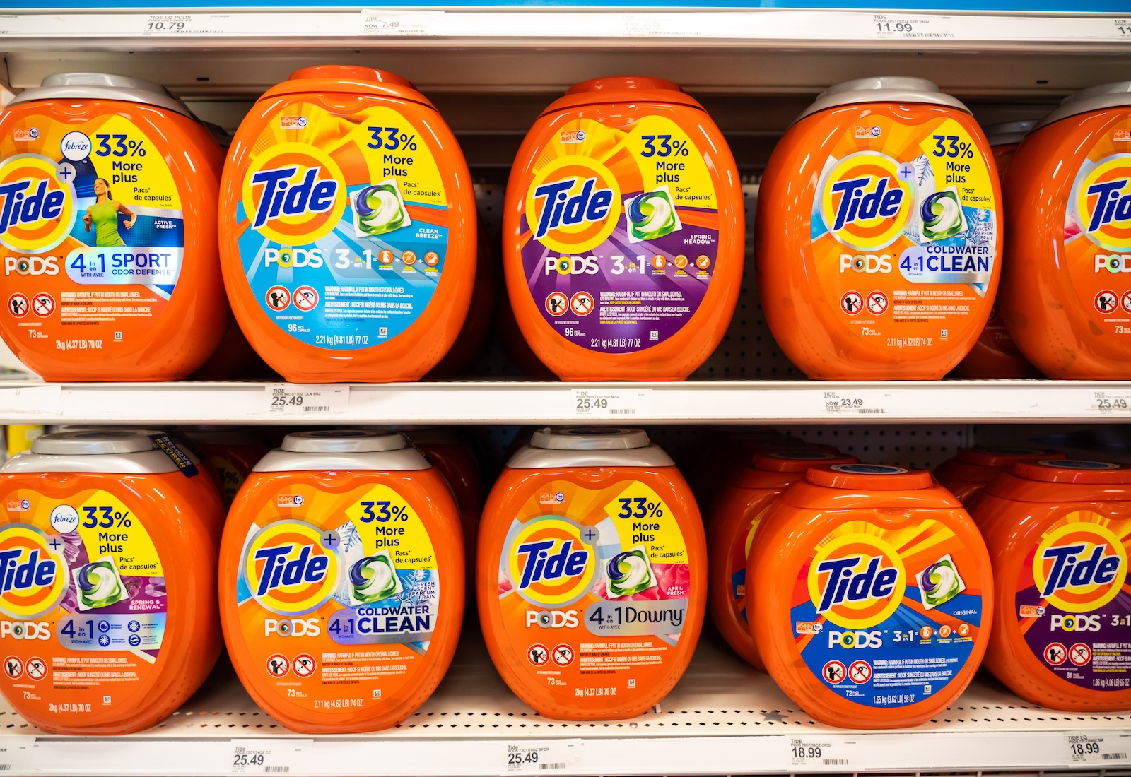 Orange tubs of Tide Pods on a shelf