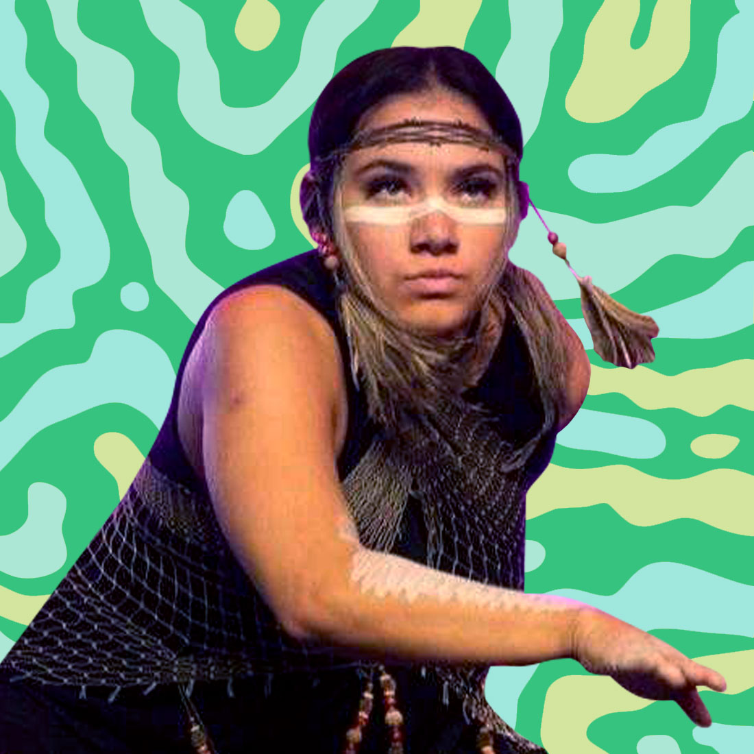 A headshot of a young person with painted arms and face in a dance-like movement a green and yellow striped background