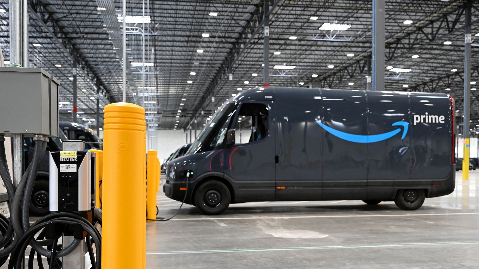 An electric Rivian delivery truck at an Amazon distribution facility in Aurora, Colorado.