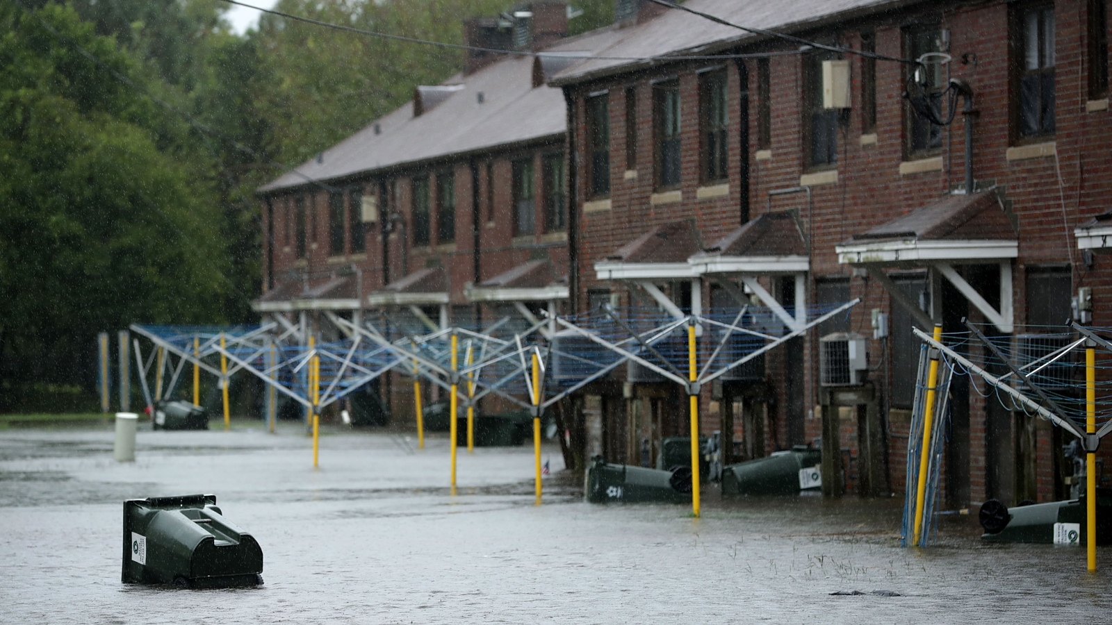 A trash can floats through the Trent Court public housing project in New Bern, North Carolina after Hurricane Florence in September 2018.