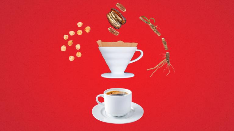 Cup of coffee with ceramic pourover surrounded by chickpeas, date and date seeds, and chicory root