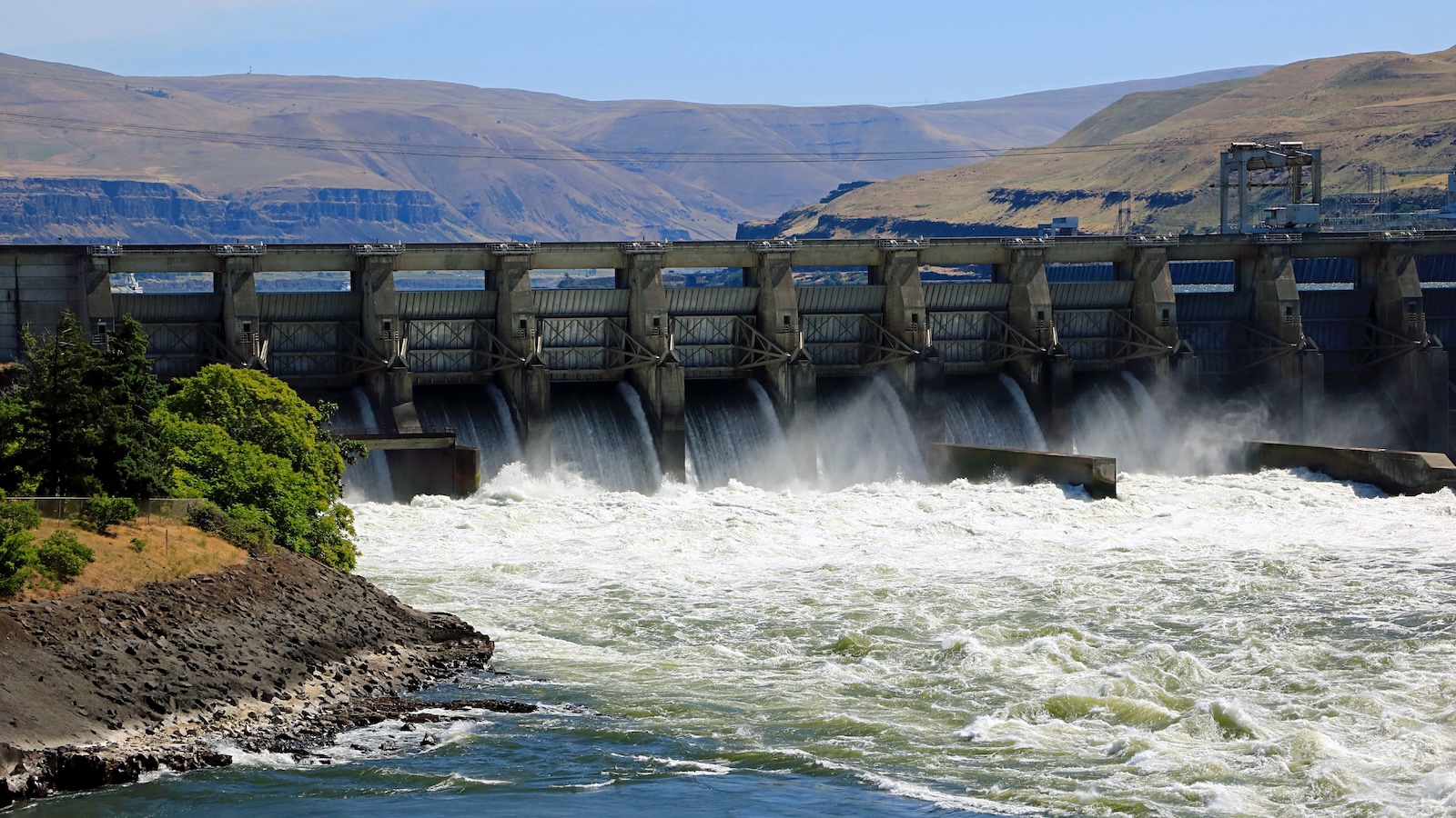 Water pours from the Dalles Dam on the Columbia River in Washington.