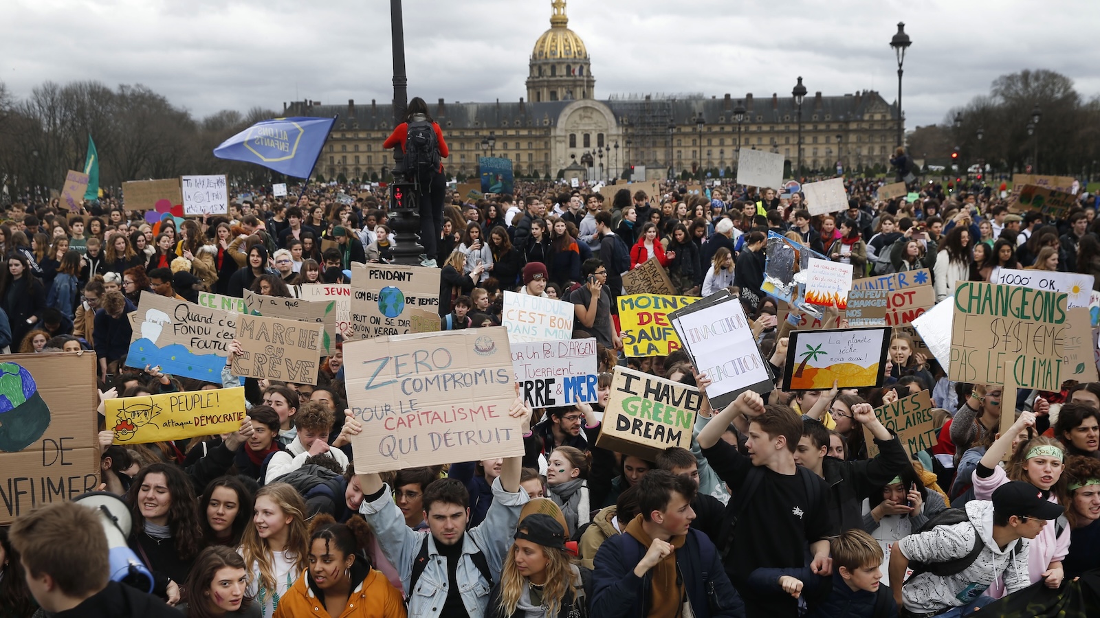 Hindreds of youth climate activists hold banners during a demonstration demanding action to address climate change on March 15, 2019 in Paris.