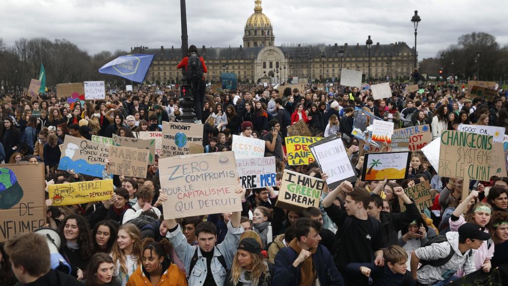 Hindreds of youth climate activists hold banners during a demonstration demanding action to address climate change on March 15, 2019 in Paris.