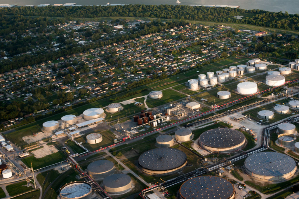 Aerial view of refineries and storage tanks near homes in Louisiana's Cancer Alley