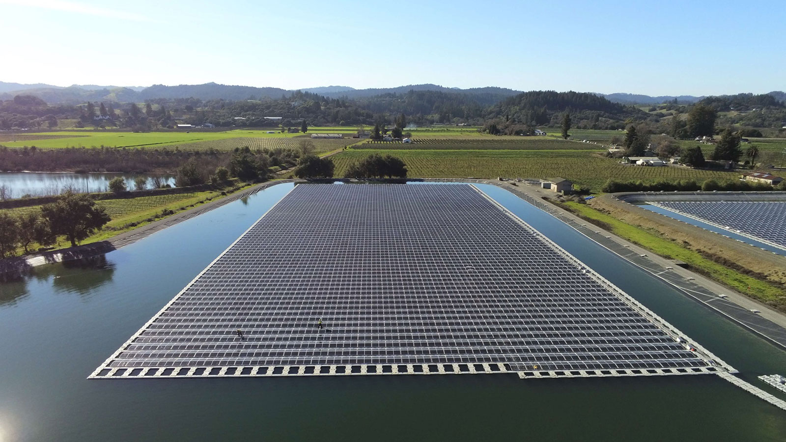 Aerial view of solar panels on a body of water