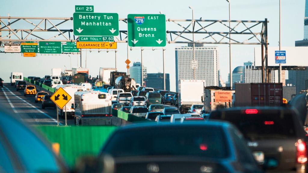 Cars get stuck in a traffic jam on a Brooklyn highway as they head toward Manhattan. New York's governor Kathy Hochul scrapped a program to charge drivers a fee for entering downtown Manhattan.