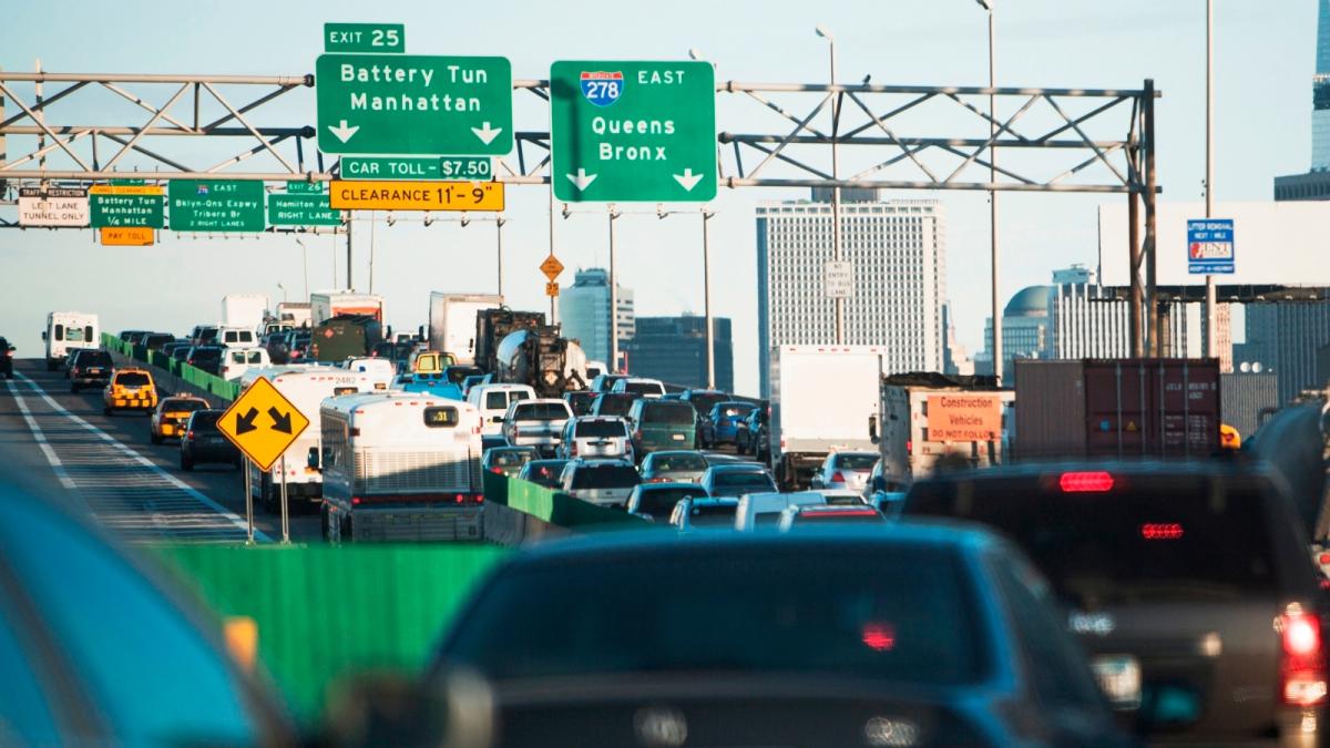 Cars get stuck in a traffic jam on a Brooklyn highway as they head toward Manhattan. New York's governor Kathy Hochul scrapped a program to charge drivers a fee for entering downtown Manhattan.