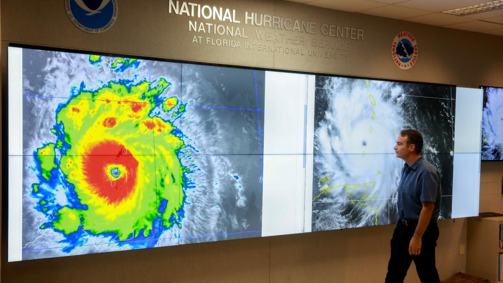 John Cangialosi, senior hurricane specialist at the National Hurricane Center, inspects a satellite image of Hurricane Beryl, the first hurricane of the 2024 season.