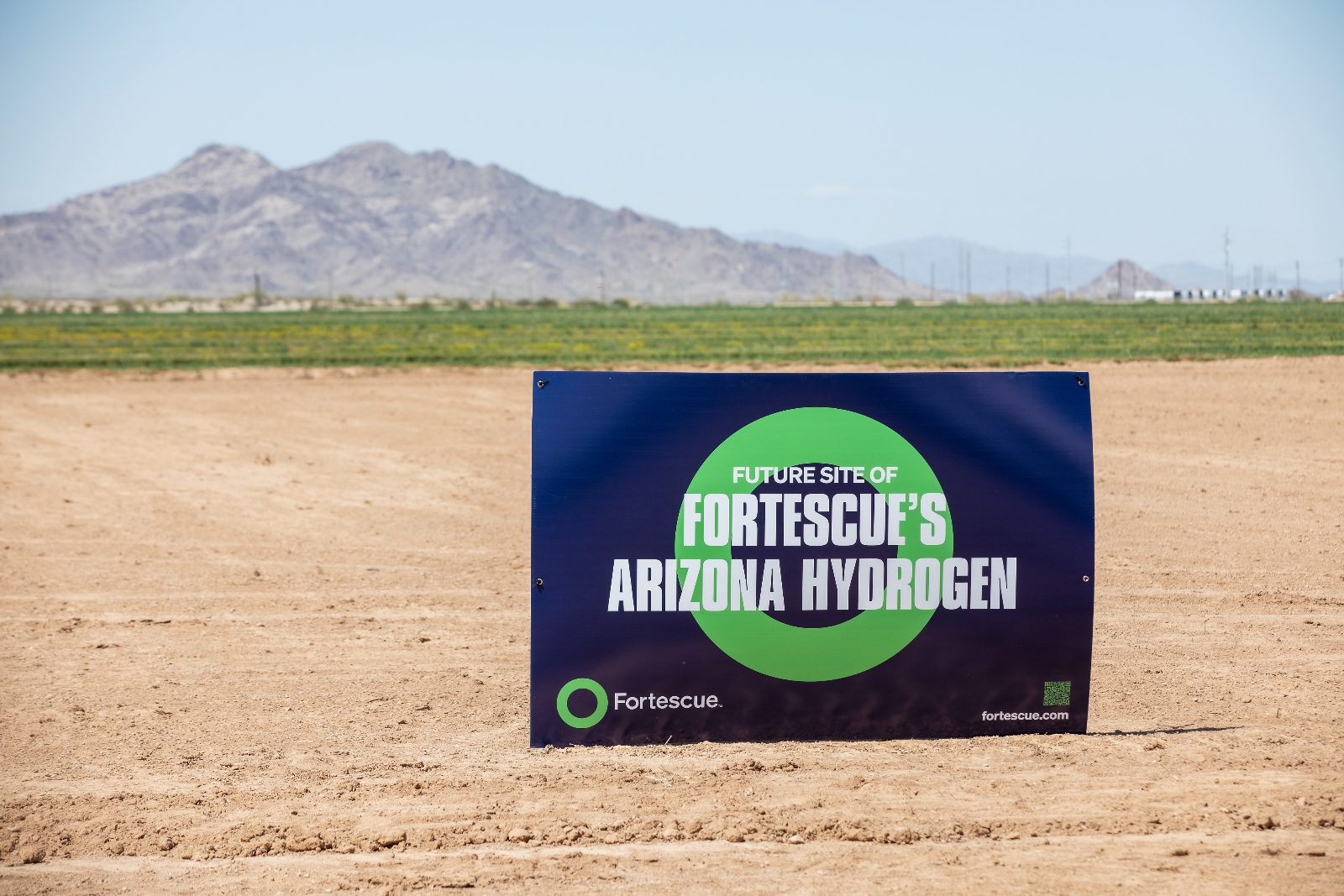 A sign that reads Fortescue Arizona Hydrogen in the middle of the desert