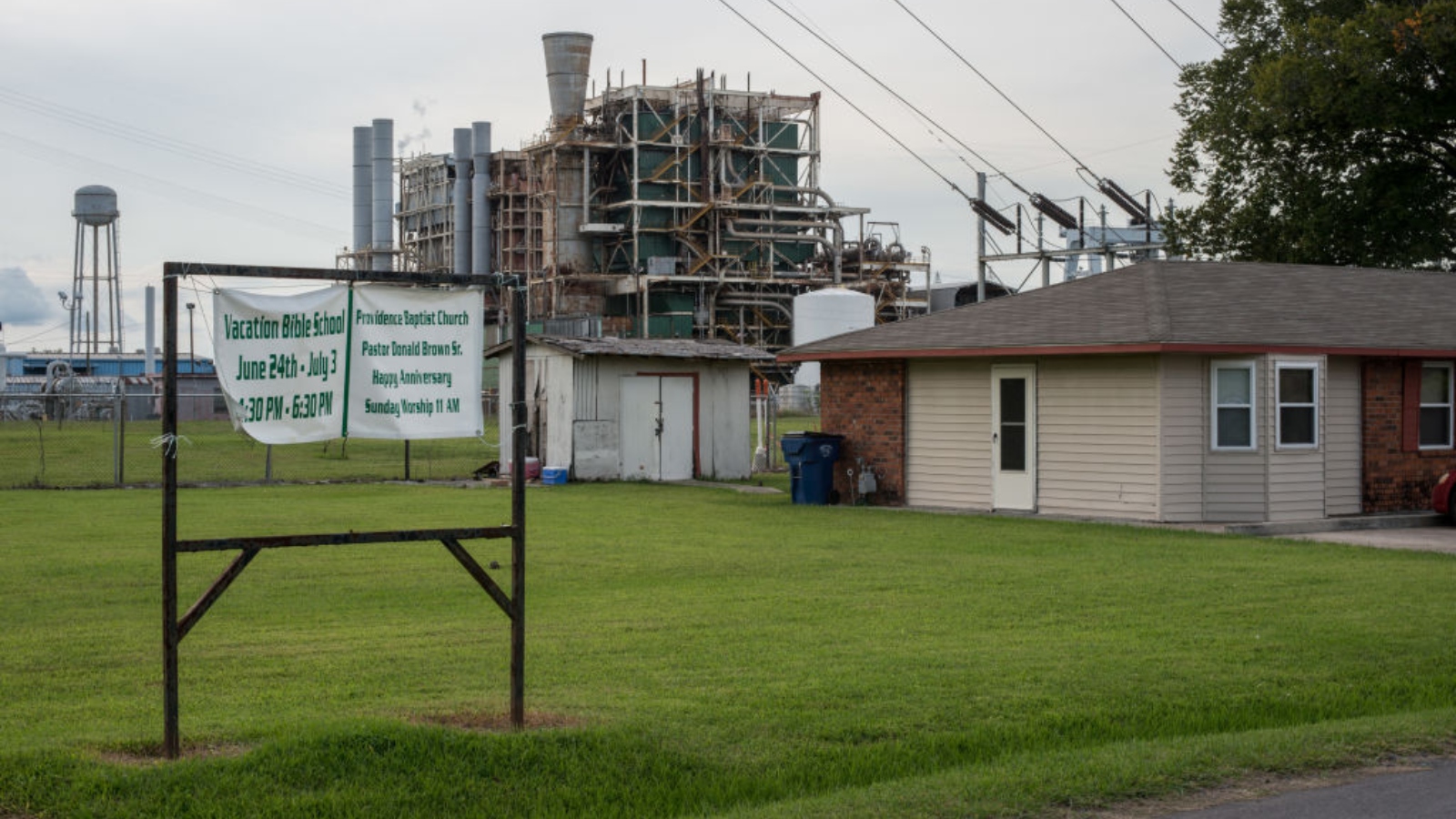 A home sits next to the long stretch of the Mississippi River and many chemical plants in Baton Rouge, Louisiana.