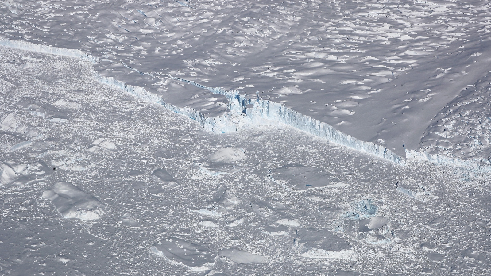 Overview shot of a huge sheet of ice with a crack in the middle