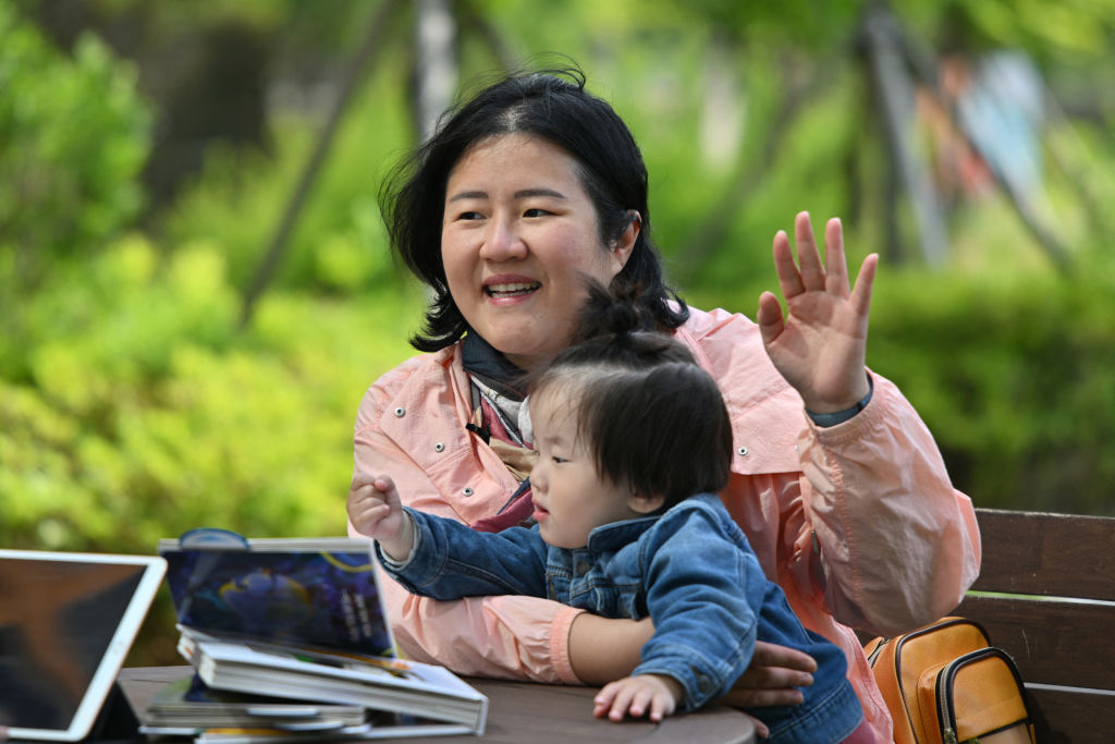 Mother holding young son