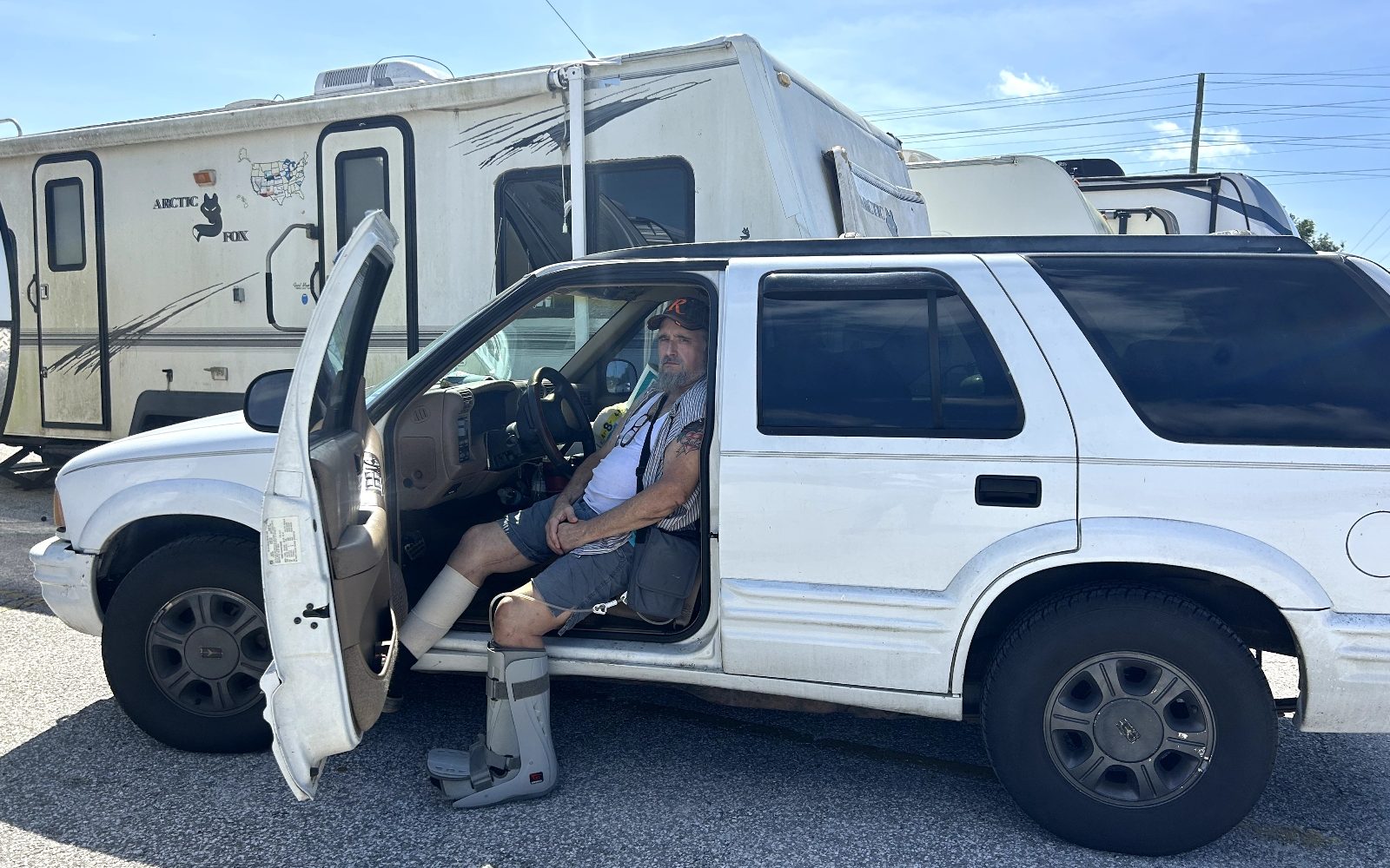 James Pike sits in his car in a grocery store parking lot after Hurricane Helene. Pike and others evacuated a mobile home park in Yankeetown, Florida, which saw ten feet of storm surge.