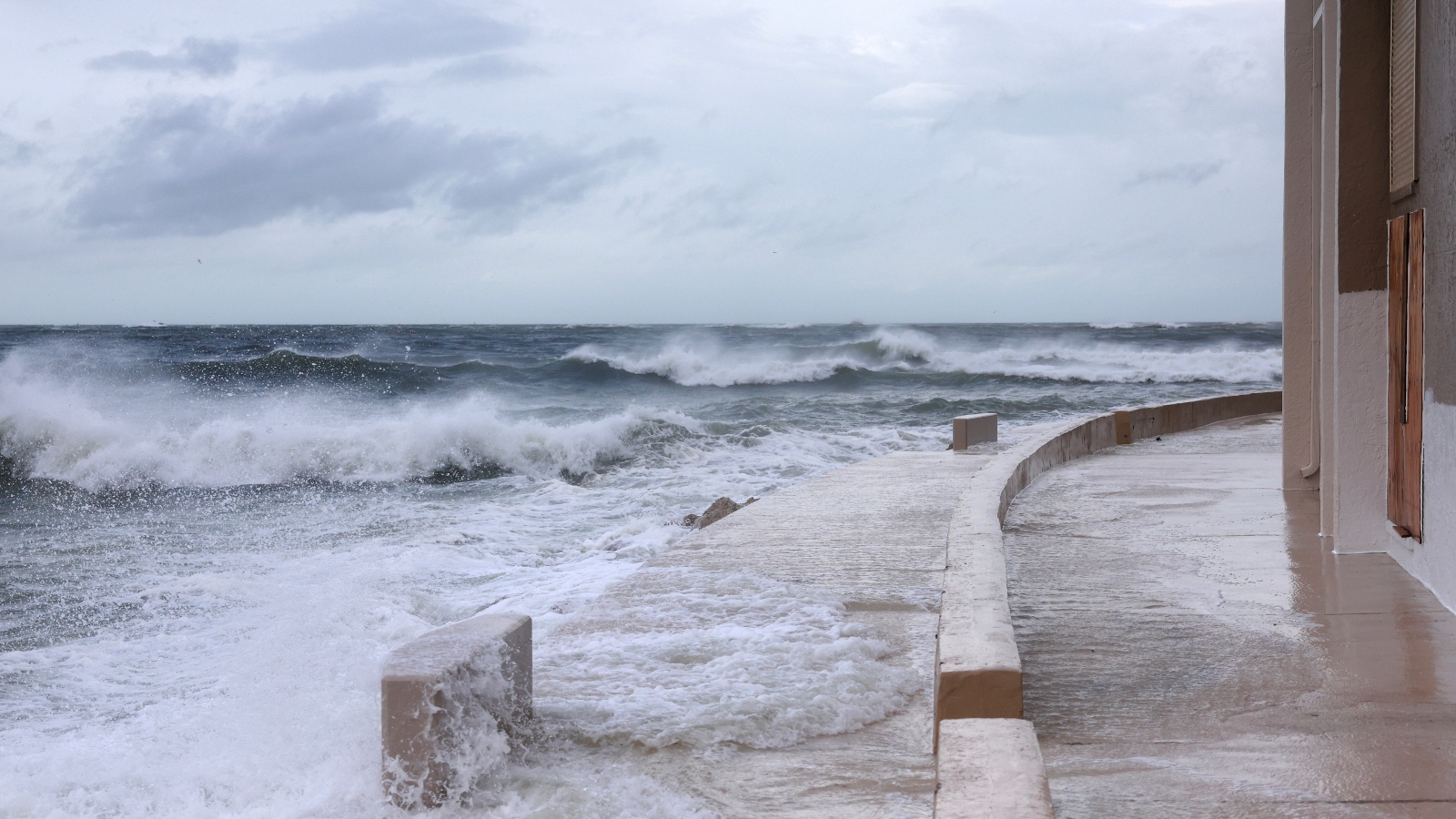 Waves from the Gulf of Mexico crash ashore as Hurricane Helene makes landfall on September 26, 2024 near St. Pete Beach, Florida, flooded.