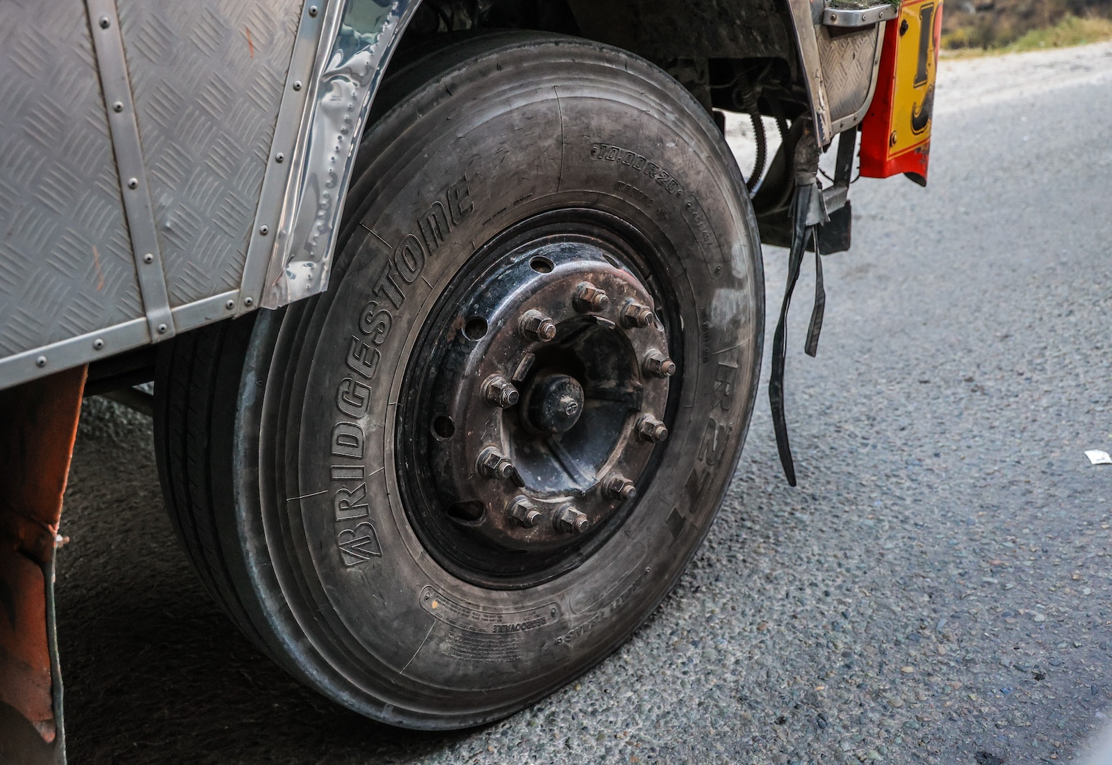 Close-up of a worn black tape, with the word "Bridgestone" written on it.