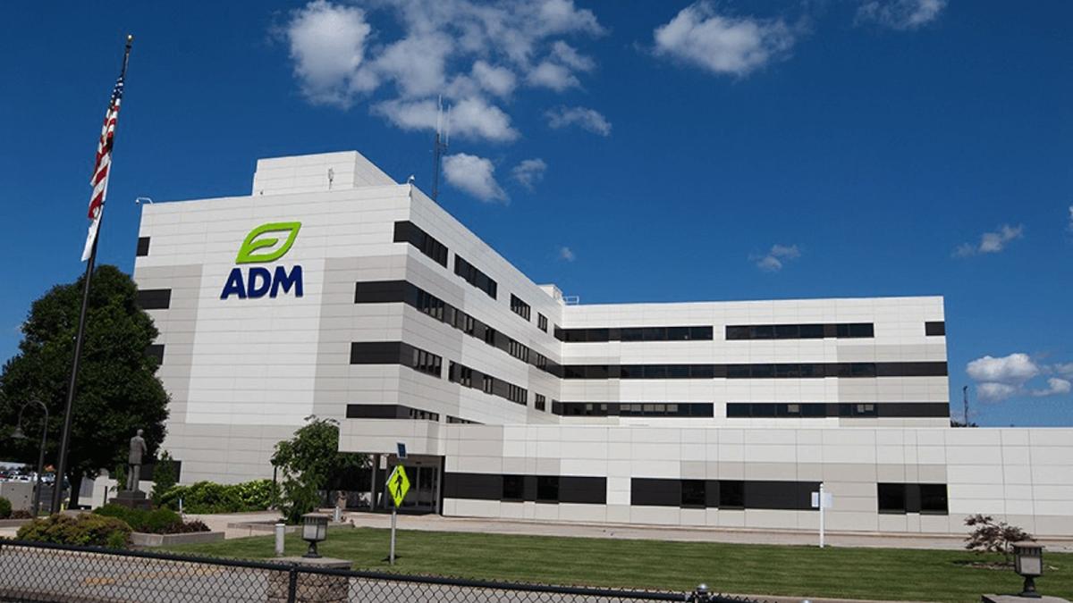 A multistory commercial building that says ADM