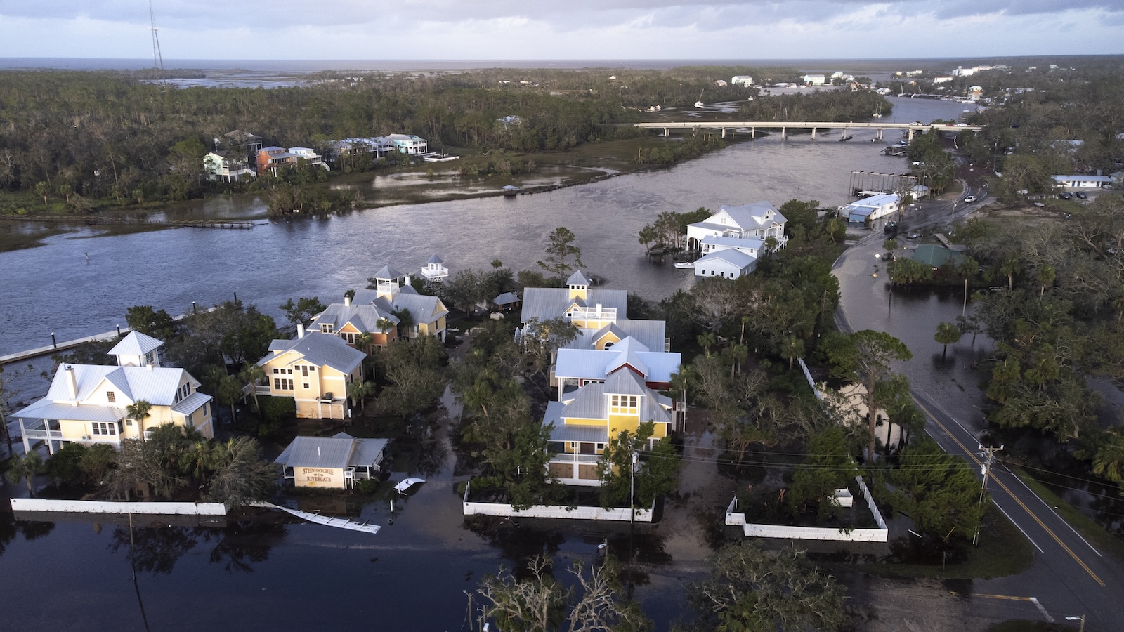 An aerial view of coastal Florida homes surrounded by flooding after Hurricane Helen.