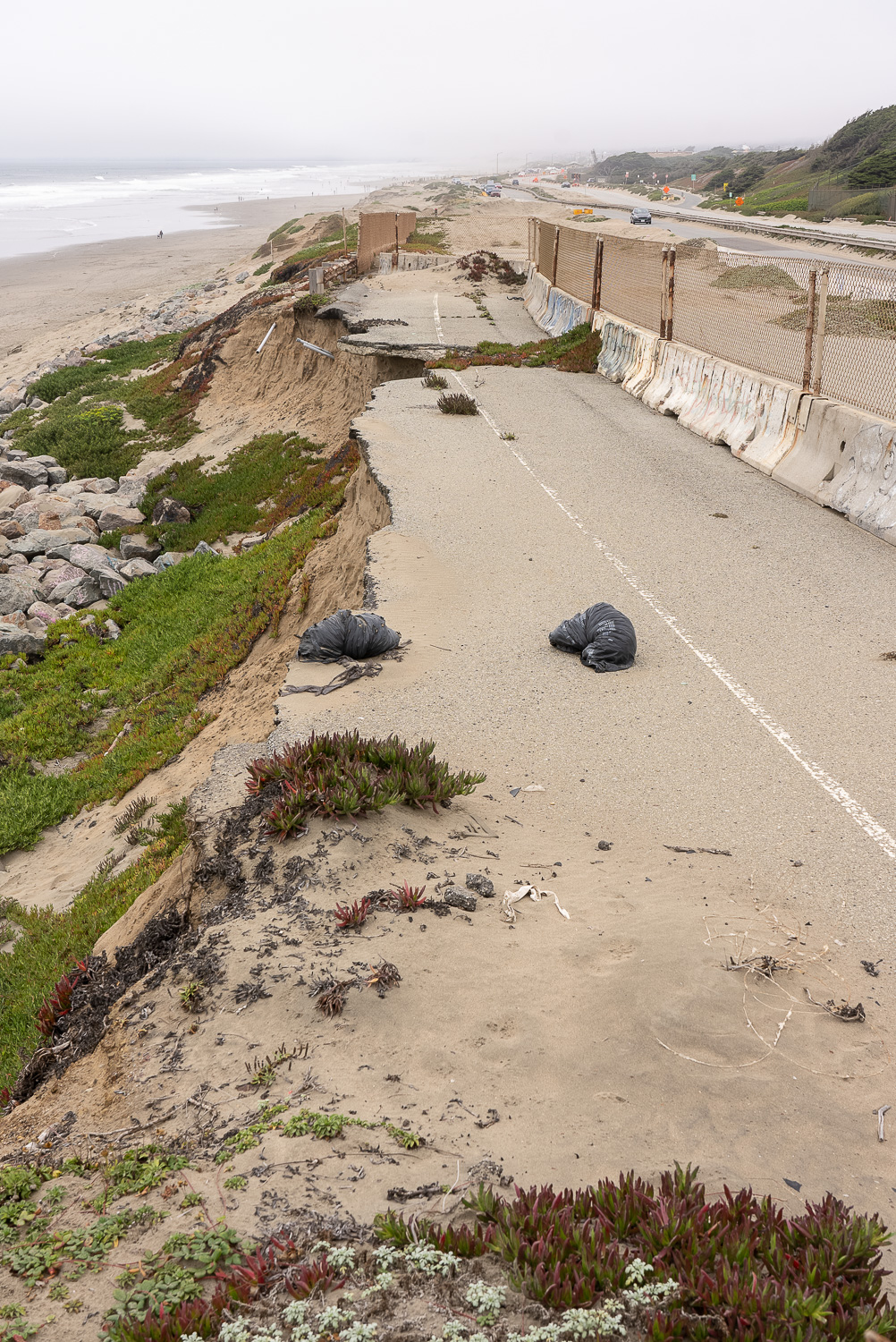 A stretch of Ocean Beach with eroded road