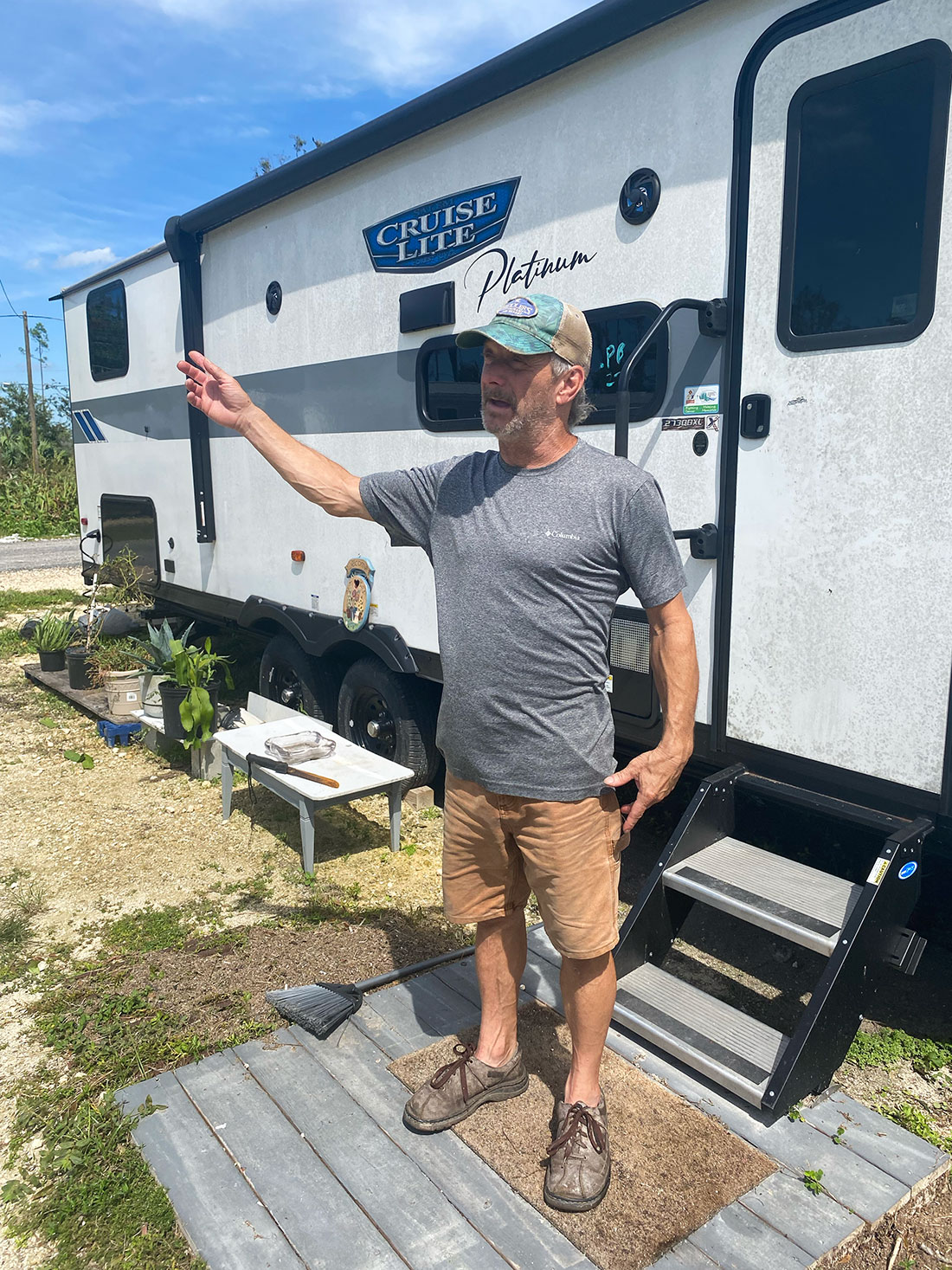 Tony Lacey stands in front of his FEMA trailer in Paradise Park, a mobile home park in Perry, Florida. Lacey has been living in the trailer since Hurricane Idalia destroyed his previous home in Horseshoe Bend last year.