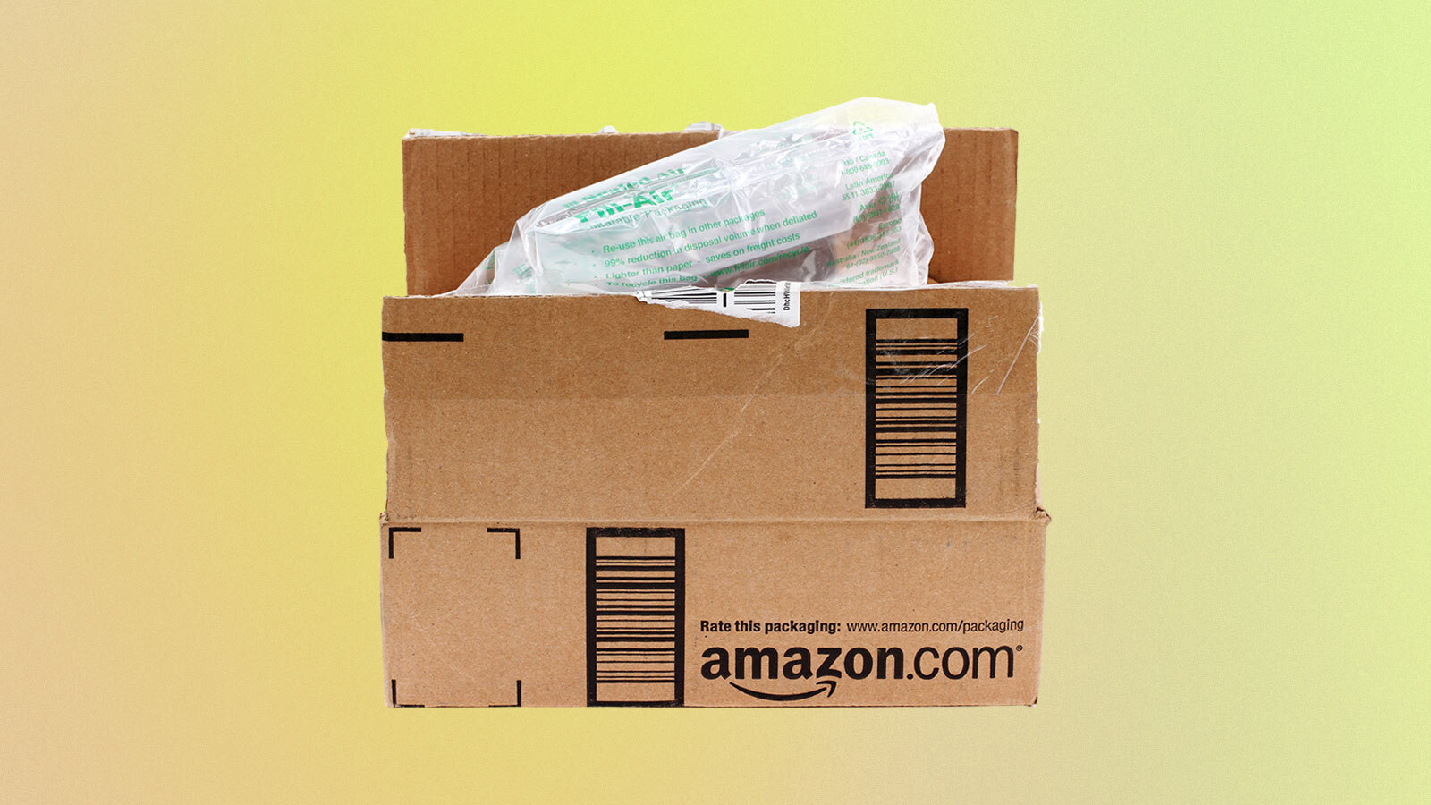 An amazon box with plastic air packaging inside on a green and peach gradient background