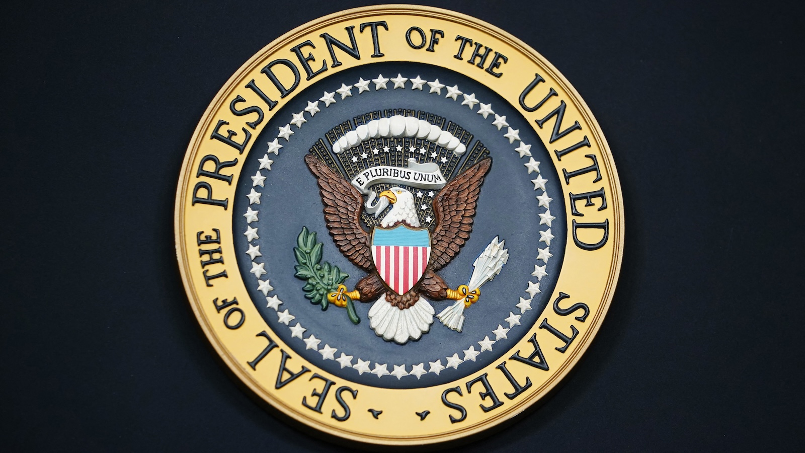 Presidential seal on black background