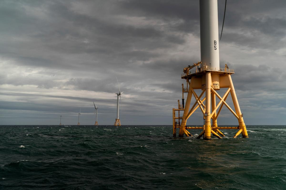 FIve offshore wind turbines in the ocean