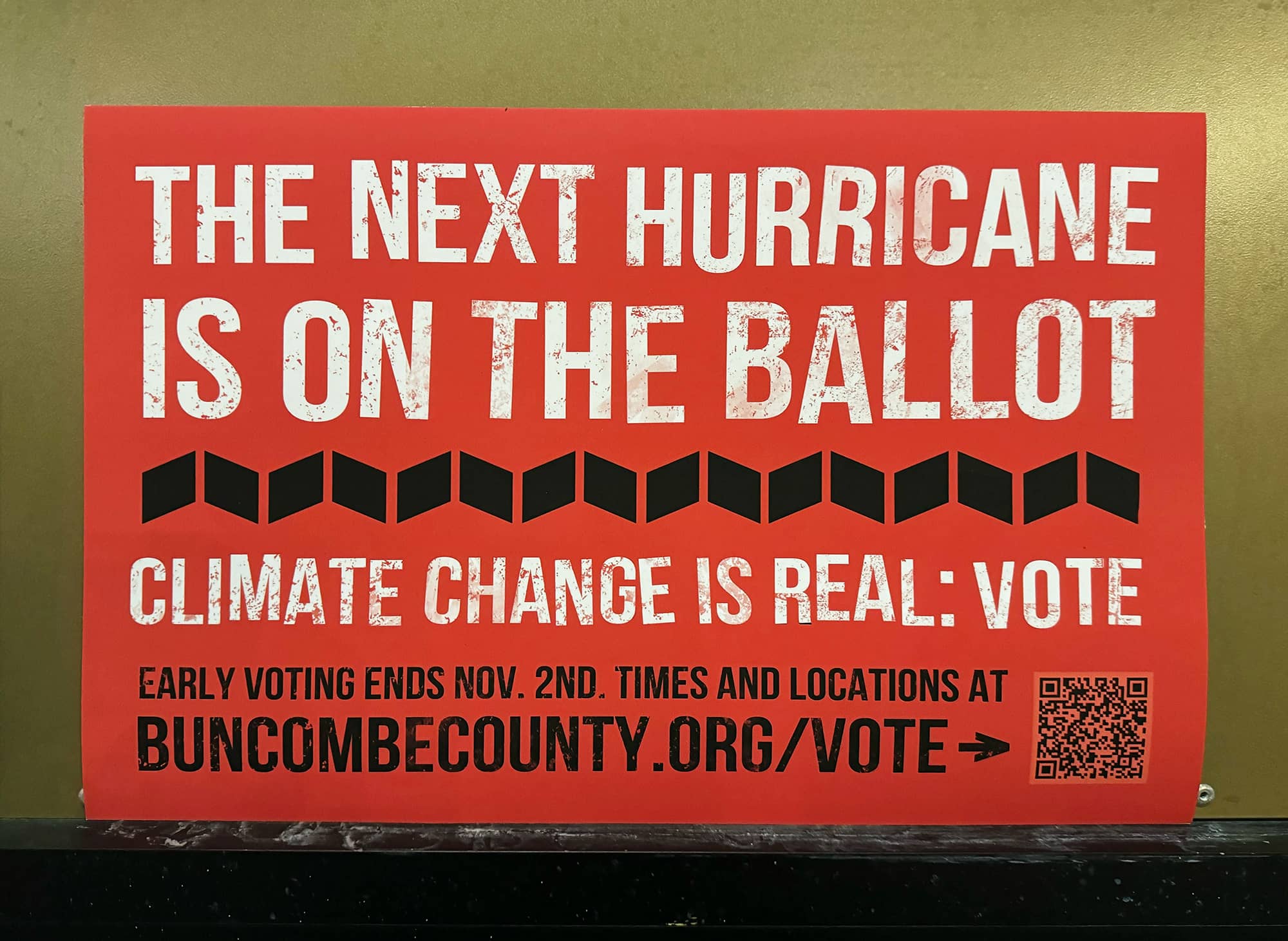 A sign at a restaurant in Asheville, North Carolina, with the words 'The next hurricane is on the ballot, climate change is real - vote'