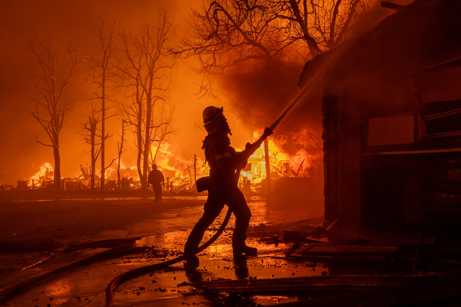 Firefighters battle the Eaton Fire near the Altadena area of Los Angeles, California. The fire exploded in strength earlier this week amid a fierce Santa Ana windstorm.