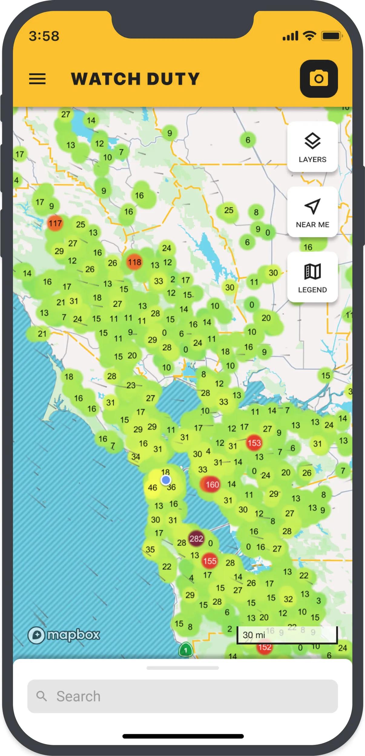 A cell phone image shows the locations of wildfires in the Los Angeles area