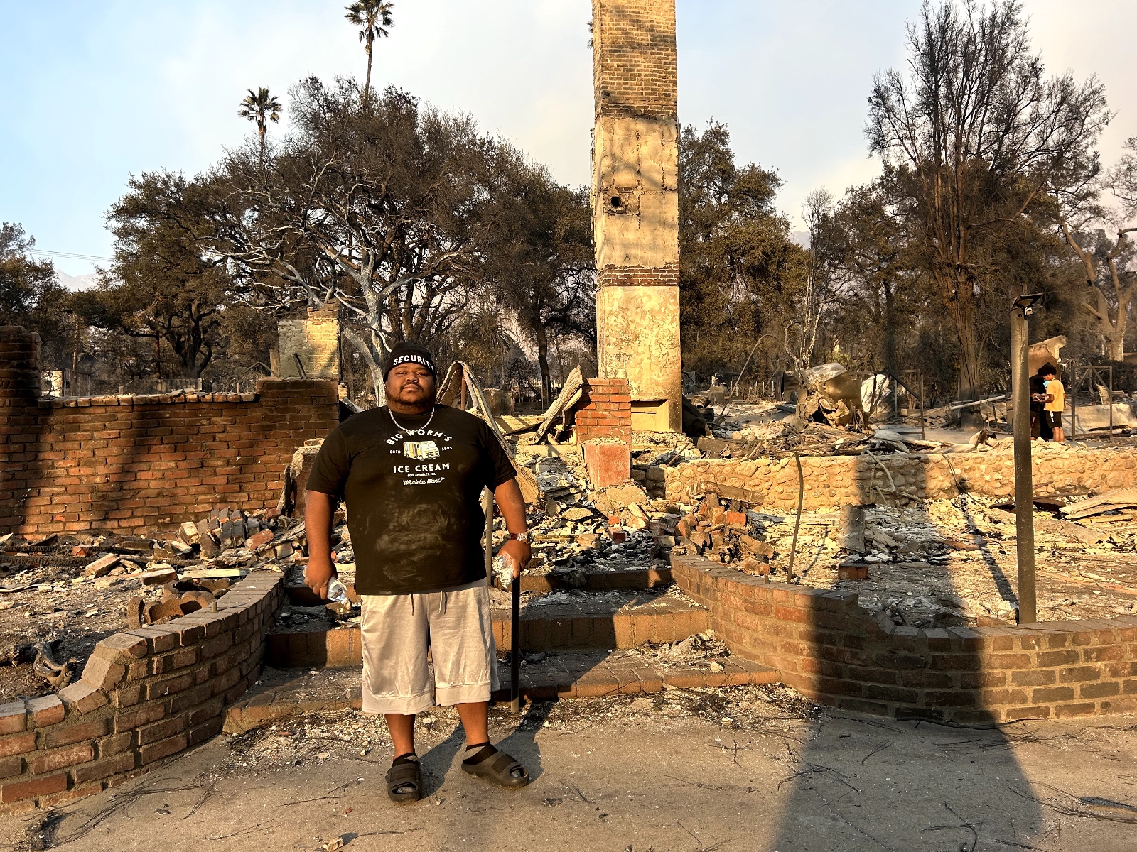 Kevin Devine stands in front of his destroyed home in the Altadena area in Los Angeles, California. Devine and thousands of other lost their homes to the Eaton Fire.