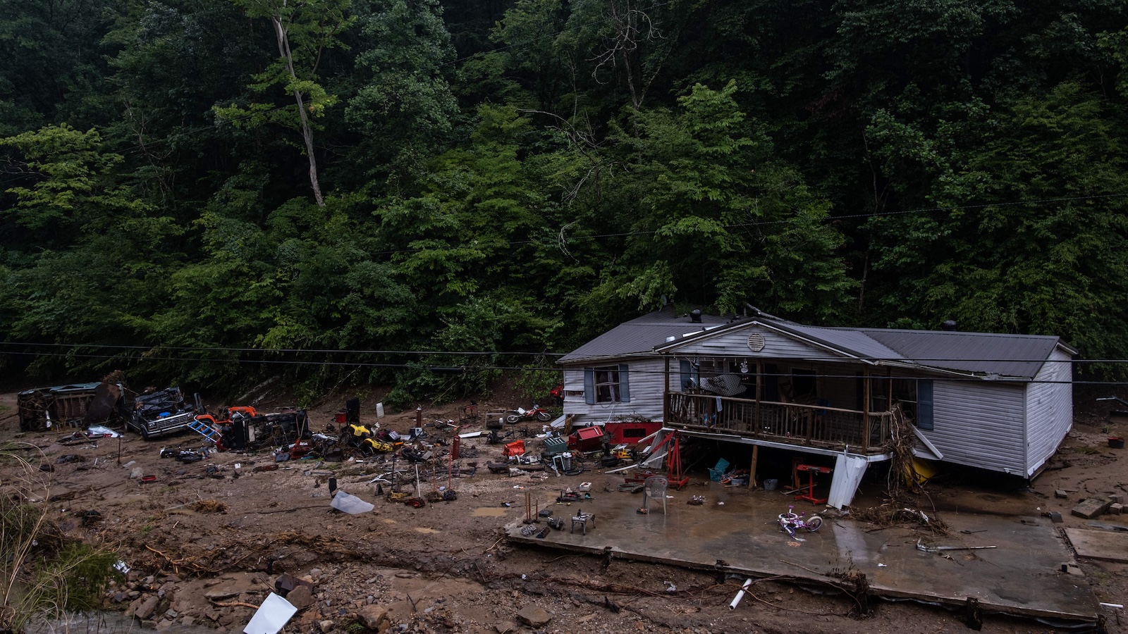 A devastated home is seen among the mud and debris left by receding floodwaters in rural Kentucky.