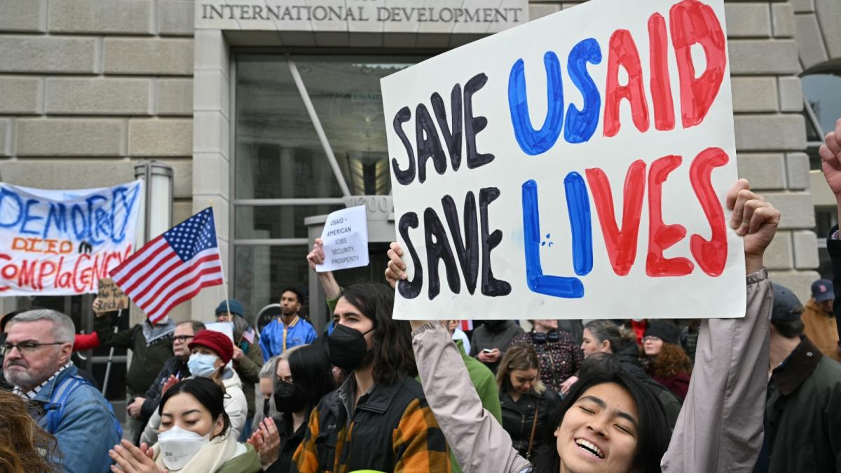 People protest outside of the headquarters for United States Agency for International Development (USAID), before Congressional Democrats hold news conference in Washington, DC, on February 3.