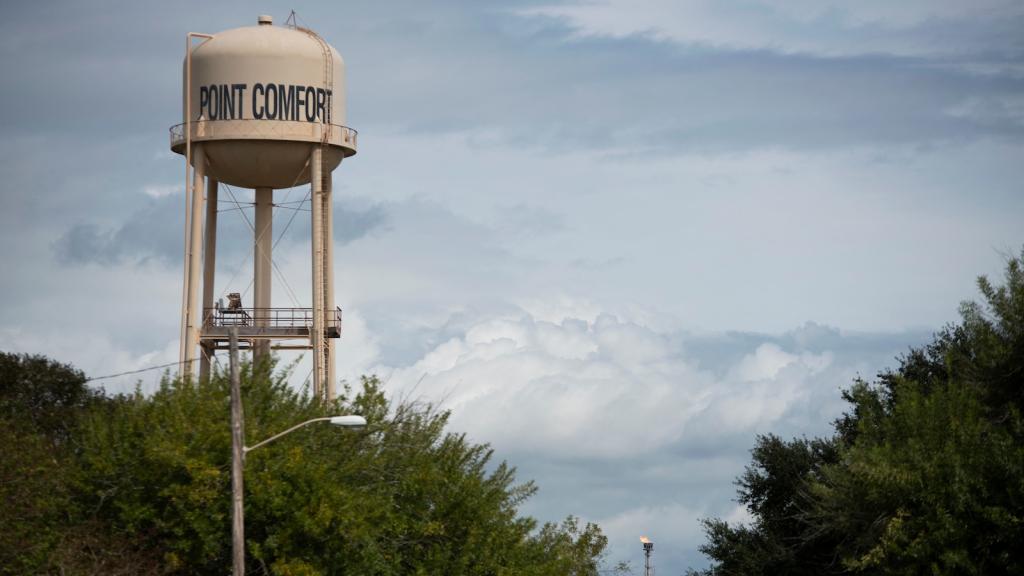 A large water tower reads 