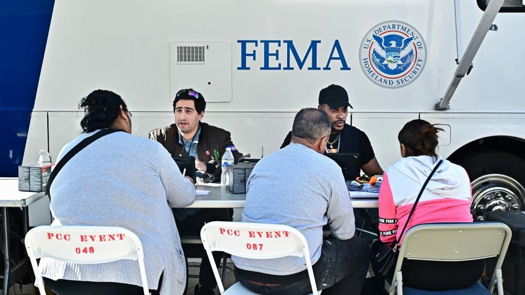 Fire victims meet with FEMA officials on January 14, 2025 in Pasadena, California, where a FEMA opened a recovery center to help residents who lost their homes or businesses.
