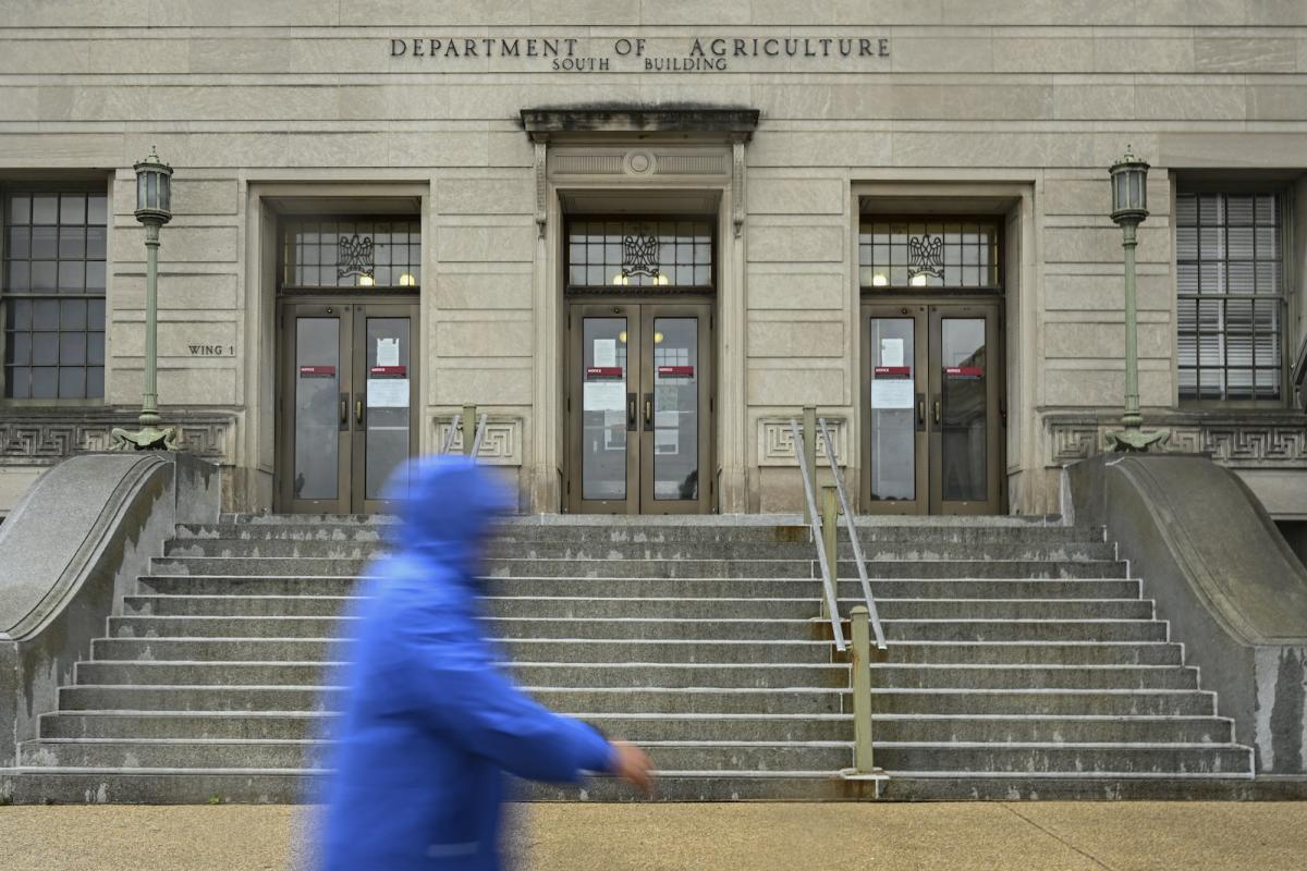 A man walks in front of the USDA building in Washington