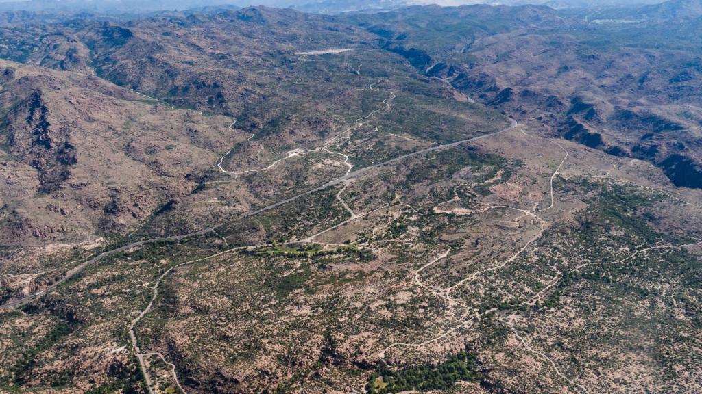 An aerial view of green and brown desert