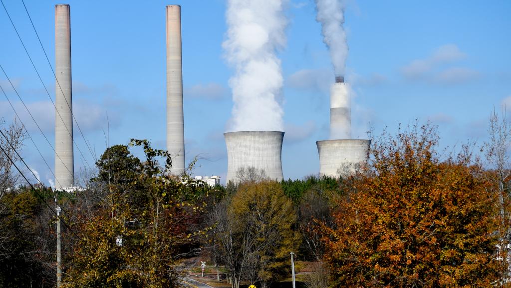 Power plant with two chimneys pouring out steam.